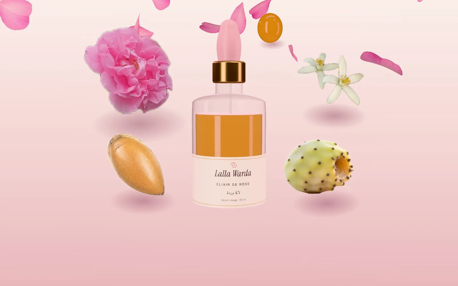 A bottle of Rose Elixir surrounded by petals, argan nuts, prickly pear and orange blossom