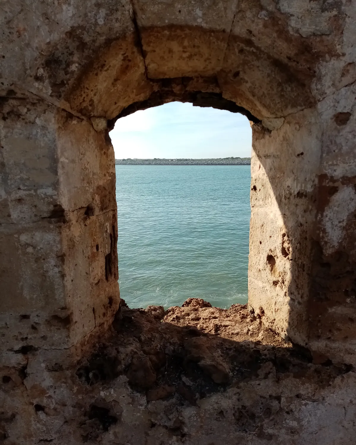 A window in the Mehdia kasbah looking out over the mouth of the Sebou, near Kenitra